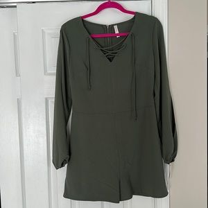 skort, Olive green. Cold shoulder openings and slits in the lower arm